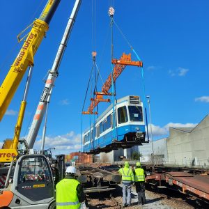 Swiss trams reloaded by crane to to rail