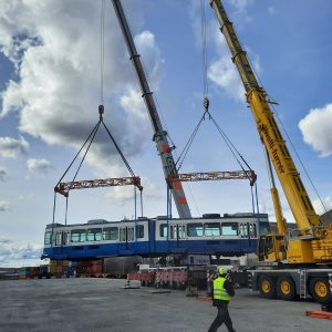 Swiss trams reloaded by crane to to rail
